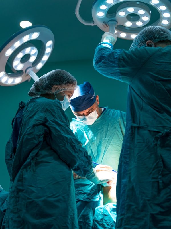 a group of doctors performing surgery on a patient